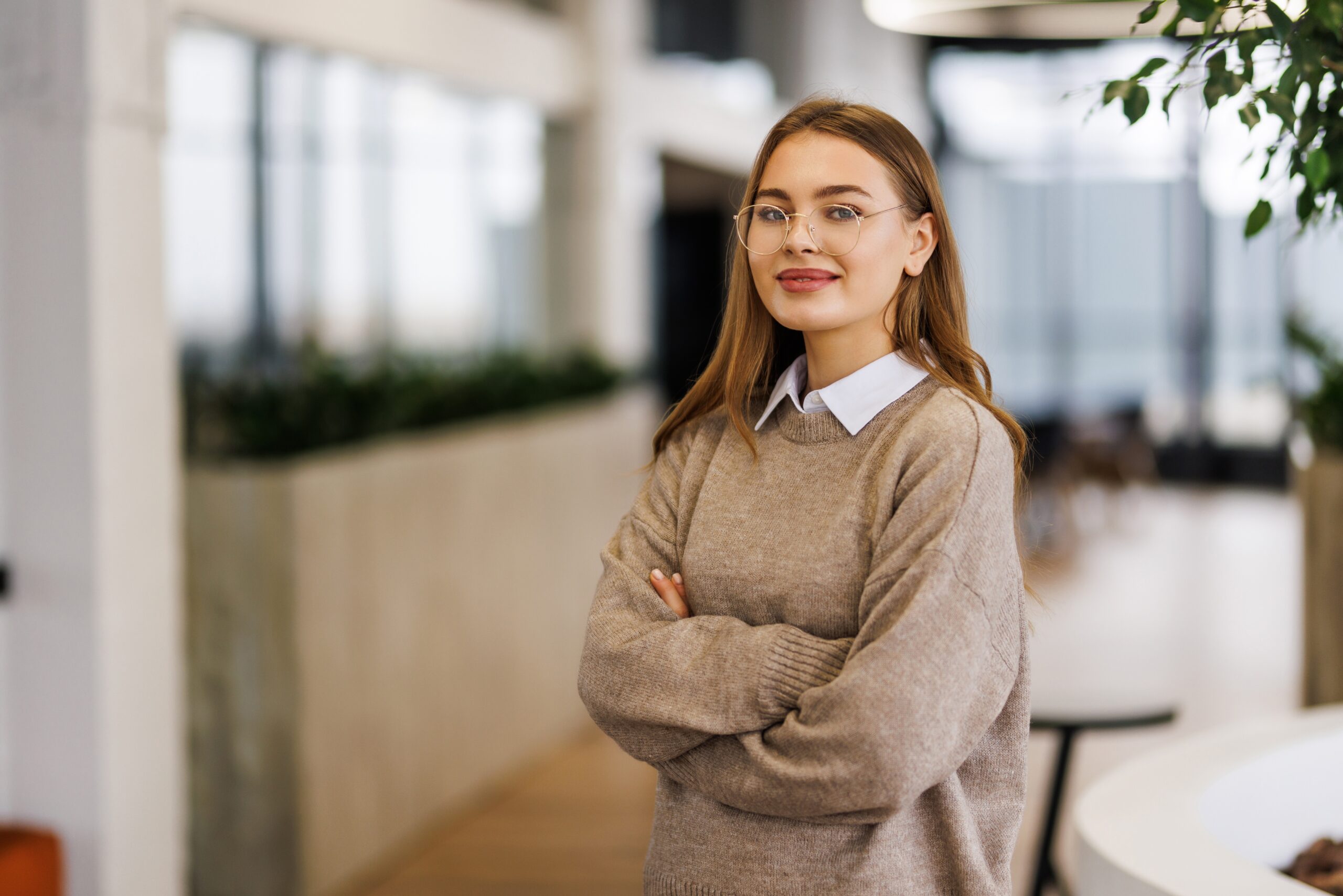 A face-to-face marketing intern crossing her arms