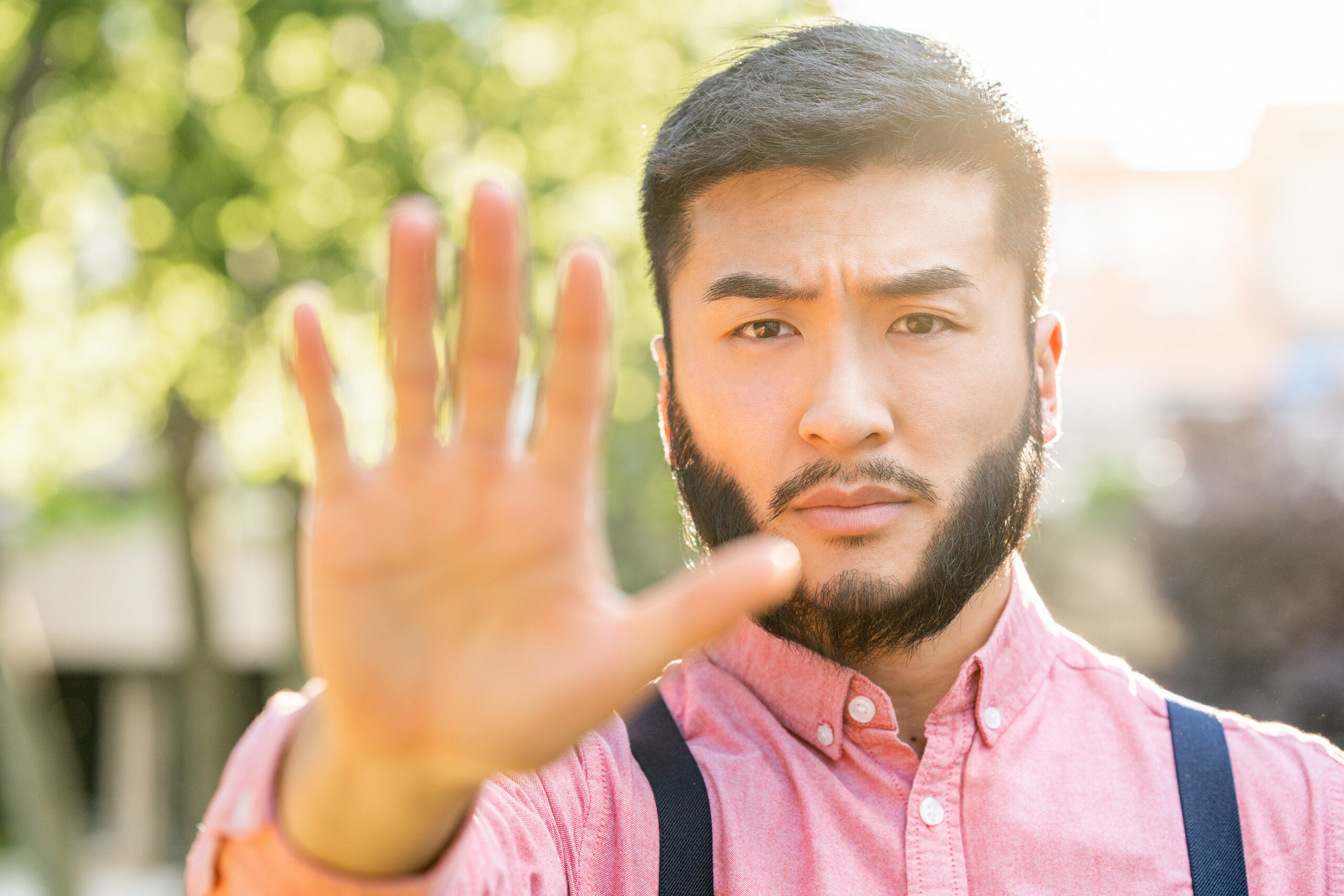 A man who holds this hand up to a person with a sales mindset