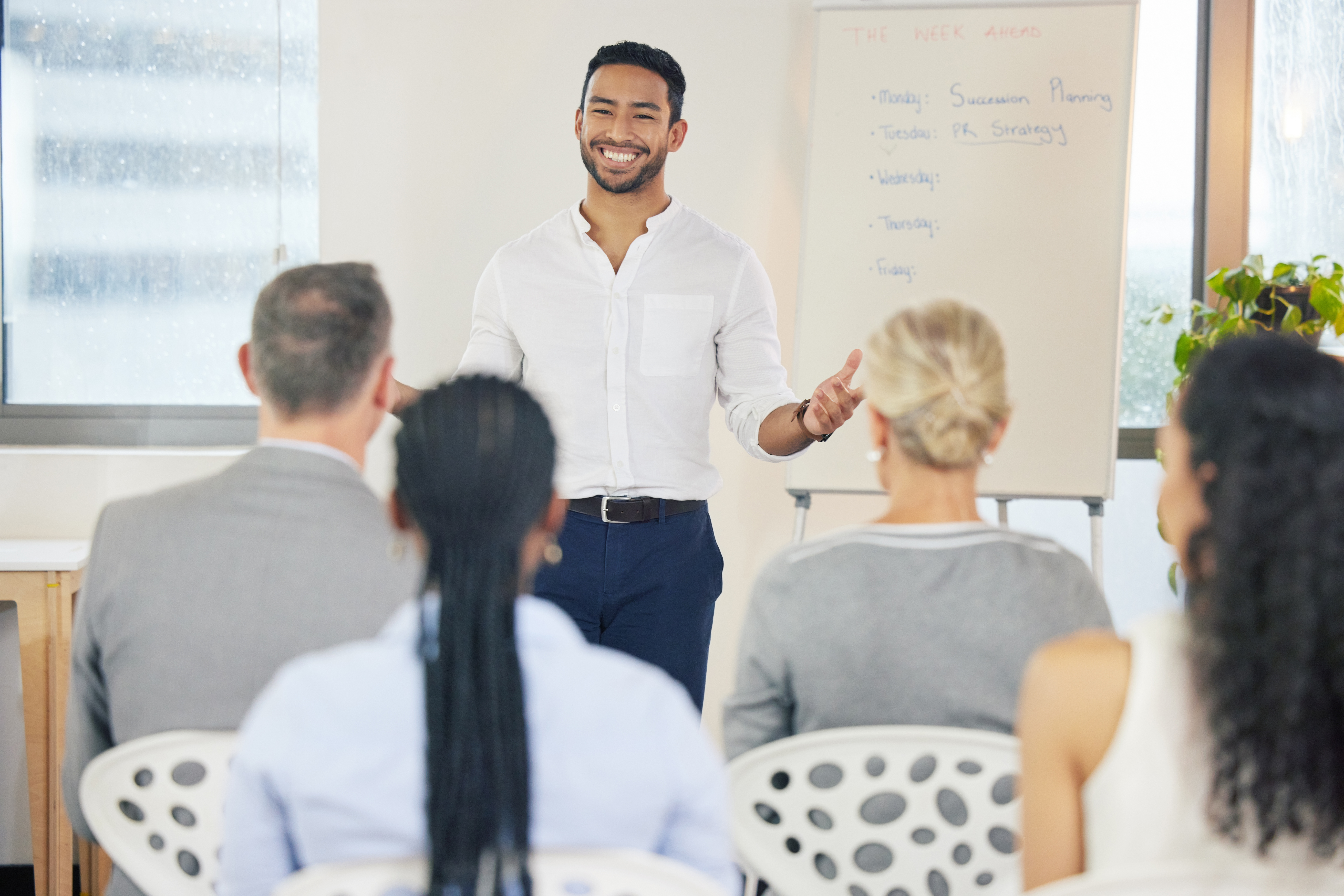 A top sales performer leading a leadership and management training session